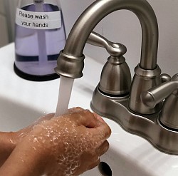 Wash hand regularly with soap and water